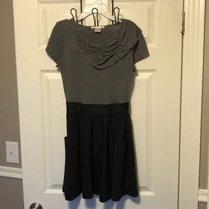 Short dress. Gray on top. Black shirt on bottom.